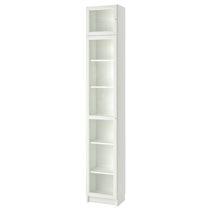 a tall white bookcase with three shelves