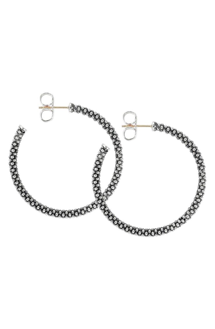 Caviar beading defines a sophisticated pair of hoop earrings cut from brilliant sterling silver. Style Name:Lagos Medium Caviar Hoop Earrings. Style Number: 254835. Available in stores. Small Hoop Sterling Silver Jewelry With Diamond Cut, Sterling Silver Hoop Jewelry With Diamond Cut, Silver Beaded Hoop Earrings In Sterling Silver, Elegant Round Hoop Earrings With Oxidized Finish, Silver Sterling Beaded Hoop Earrings, Silver Beaded Sterling Silver Hoop Earrings, Hoop Silver Beads Jewelry Gift, Hoop Silver Bead Jewelry Gift, Elegant Sterling Silver Hoop Earrings With Round Beads