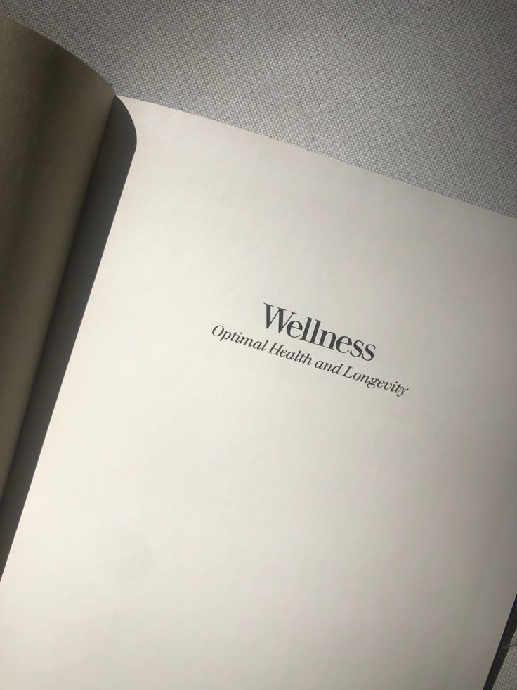 an open book with the words wellness on it's front cover and bottom page