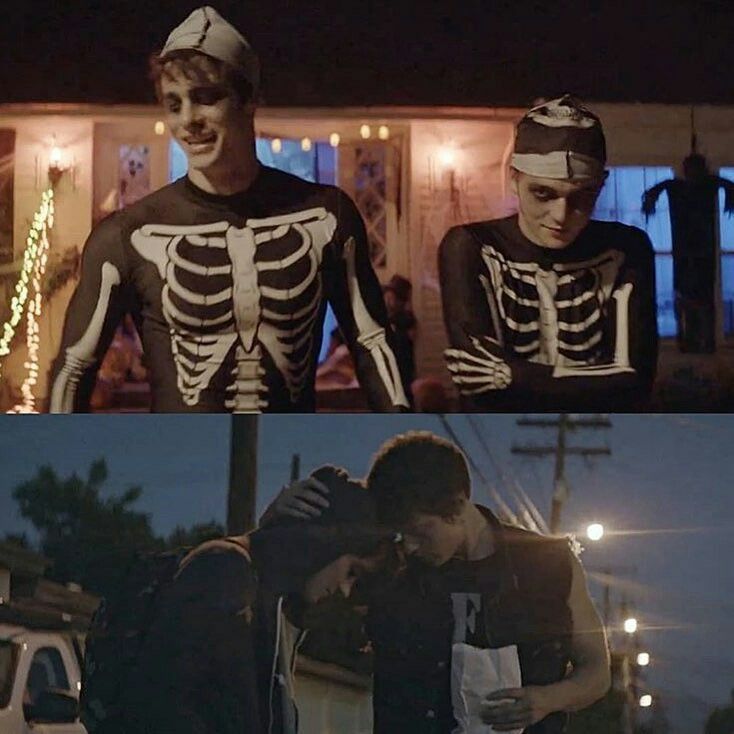 two men in skeleton costumes standing next to each other and one is hugging the other