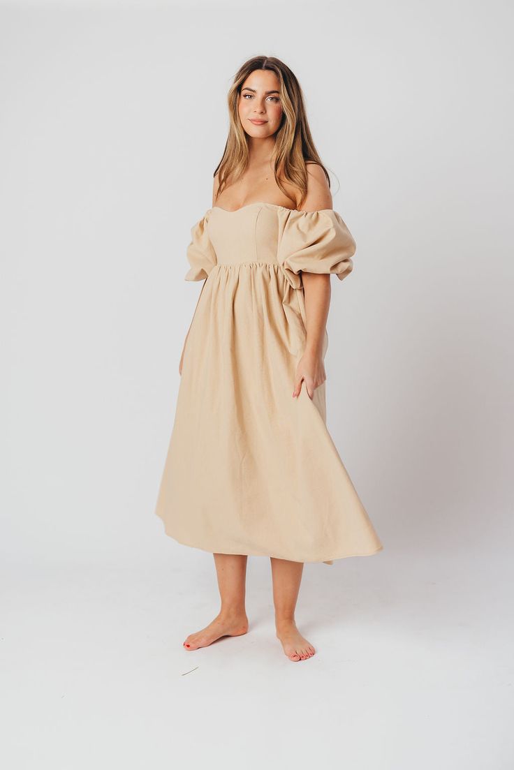 The Hamilton is everything you're looking for in a midi dress - charming, sophisticated, and absolutely flattering. It features premium quality details, like a sweetheart neckline and gorgeous balloon sleeves that can be worn on or off the shoulder. It's an unforgettable choice for every body type, and extra-comfy for expecting mamas! The best part? You can wear this beauty long after your sweet baby arrives! Available in multiple colorways. FIT: Runs true to size. Features a smocked back panel for comfort. This dress is roomy in the waist and will accommodate early maternity in your true size, but consider sizing up if you are in advanced pregnancy. MATERIAL: GARMENT DETAILS: Empire-waisted midi dress, with sweetheart neckline and statement balloon sleeves that can be worn on or off the s Dress With Sweetheart Neckline, Garment Details, Curve Model, Balloon Sleeves, Sweetheart Neckline, Body Types, Smocking, Off The Shoulder, Premium Quality