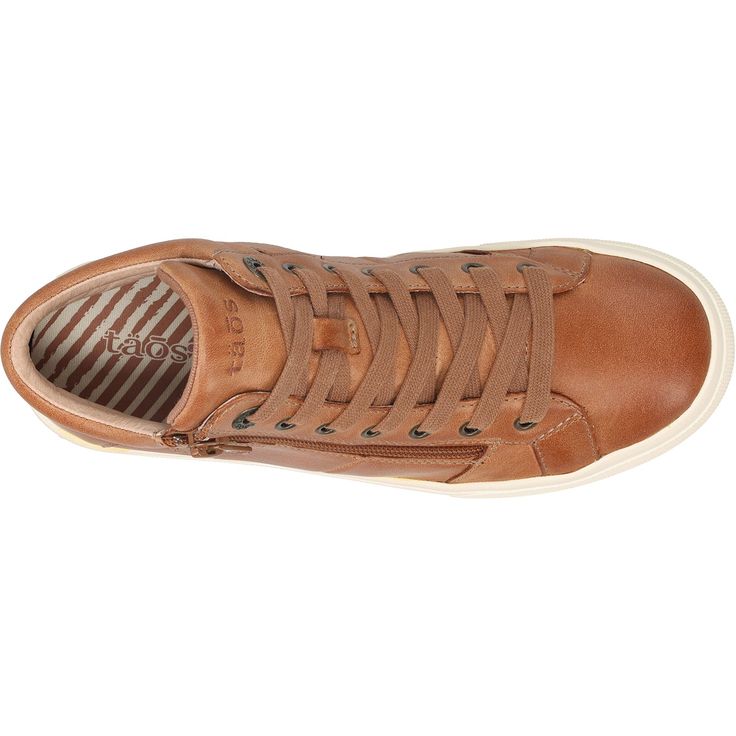 The Taos Winner is a casual women's leather high top sneaker with an outside zipper for easy on and off. These Taos Winner Caramel Leather Women's Boots have the following features: Upper Material Leather Lining Canvas Insole Design Molded, Contoured Insole Material Polyurethane/canvas covered Footbed Lining Canvas Forefoot Cushioning Arch Support Metatarsal Support Orthotic Friendly Outsole Rubber Heel Height 1 1/8" WNR-14003 Baggallini Bags, Insole Design, Athleisure Sneakers, High Top Sneaker, Leather High Tops, Flip Flop Shoes, Leather Boots Women, Taos, Trail Shoes