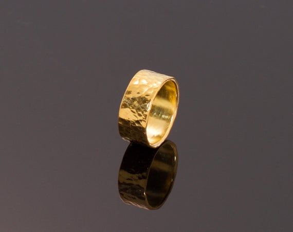 18K Solid Gold Ring in Hammered Finish- Heavy 18K Gold Band-Solid Gold RingSolid Gold in 18K. Bold LookUnisex Design. A Subtle Statement Piece.Heavy Setting, Solid Gold- Not Plated-Not Gold FilledOur Own Hammered Finish8mm Wide, Other Widths  AvailableOther Finishes AvailableOther Gold Karats AvailableCan Be Customized and EngravedHand Made in Our La Jolla, California StudioWe ship from Our Studio directlyFree Shipping in USASatisfaction Guaranteed. If not pleased return in 7 Days for refund. La Jolla California, Hammered Band, Solid Gold Band, Solid Gold Ring, Coin Ring, Peridot Ring, Solid Gold Rings, La Jolla, Gems And Minerals