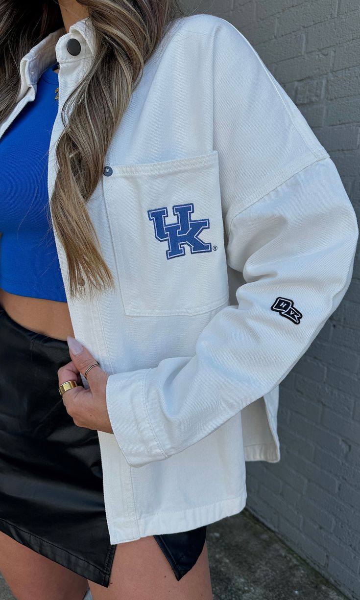 The pop of blue your game day look needed to cheer on our CATS! Wear this jacket oversized with a leather skort for a classic, but edgy look! This oversized jacket features a classic snap button front, collar, pocket and rounded hem to make a perfect breezy denim overshirt! Model is 5'6" with a 32DD bust, 27" waist, 36" hips, and wearing a large for a more oversized fit. Model usually wears size 2/4. Designed to fit oversized for an effortless and relaxed look. Stay true to size or size up for e Leather Skort, Denim Overshirt, Oversized Jacket, Edgy Look, Stay True, Snap Button, Game Day, Size 2, Collar