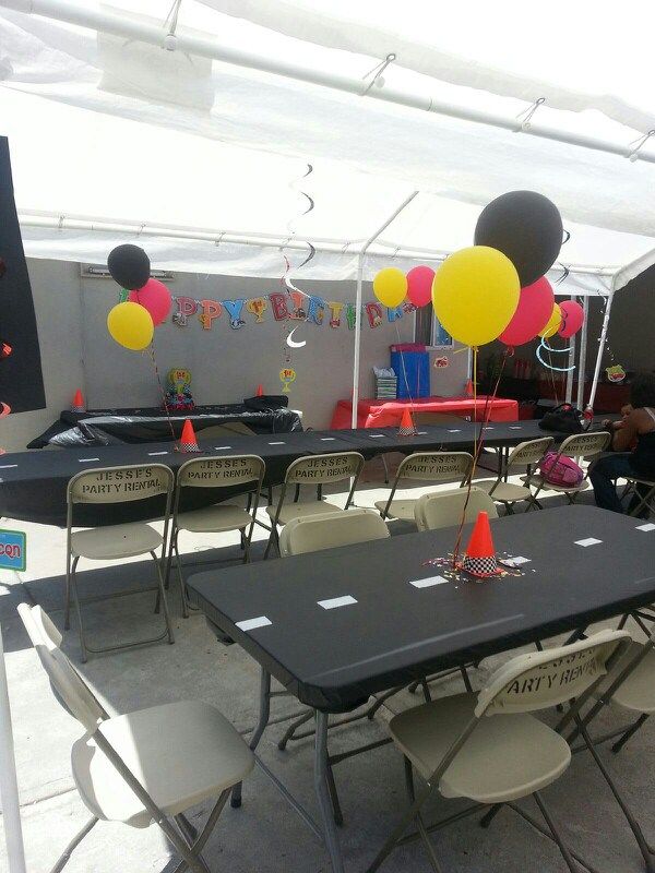 tables and chairs are set up for a birthday party