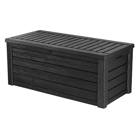 an outdoor storage box with wooden slats on the top and bottom, in dark brown