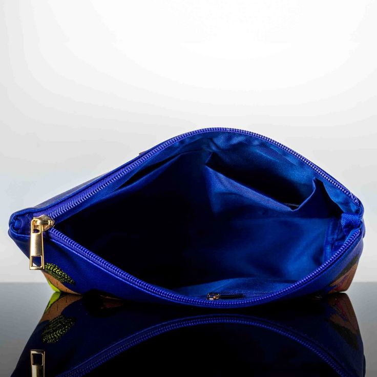 If you're looking for a vibrant, energetic way to store all of your on-the-go cosmetics, then the Pardon My Fro Women Faux Leather Squad Cosmetic Bag is perfect for you! Constructed from high-quality faux pebbled leather and with gold-tone hardware, this cosmetic bag looks as good as it performs. The bold colors make it easy to find in the depths of your handbag and ensures that your cosmetics are always within reach. And since it features an interior zip pocket and two slip pockets, you can mak Blue Clutch Cosmetic Bag For Travel, Blue Faux Leather Travel Bags, Blue Travel Coin Purse, Blue Leather Bag With Zipper Pouch, Blue Leather Bag For Personal Use, Travel Blue Clutch, Blue Cosmetic, Everything Stays, Leather Care