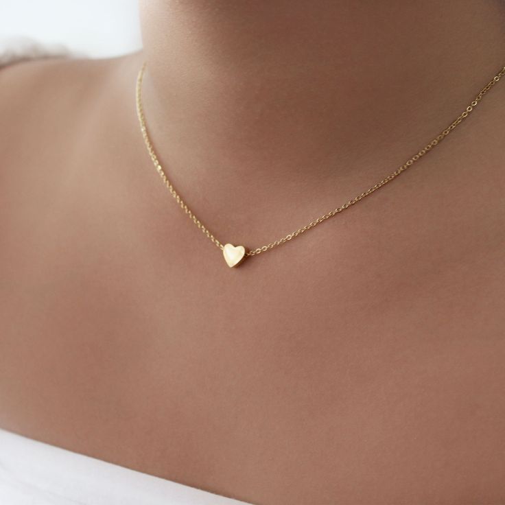 Dainty Heart Pendent Necklace - This listing is for a pair of the Dainty Heart Pendent Necklace. Perfect for every day and layering.- Base Material: High Quality Stainless Steel- Finish: 18K Gold - Length: 16" + 2" extender - Measurements: Heart - 7mm/7mm - Nickel Free and Tarnish Free- All our jewelry is packaged in gift ready boxes. If you would like multiple items from your order packaged separately please let us know!© 2023 Generation of Daughters Stainless Steel Heart Necklace, Gold Chain With Heart Pendant, Small Pendant Necklace Gold, Pendent Design, Pendent Gold, Heart Pendent, Gold Pendent, Gold Heart Pendant, Pretty Jewelry Necklaces