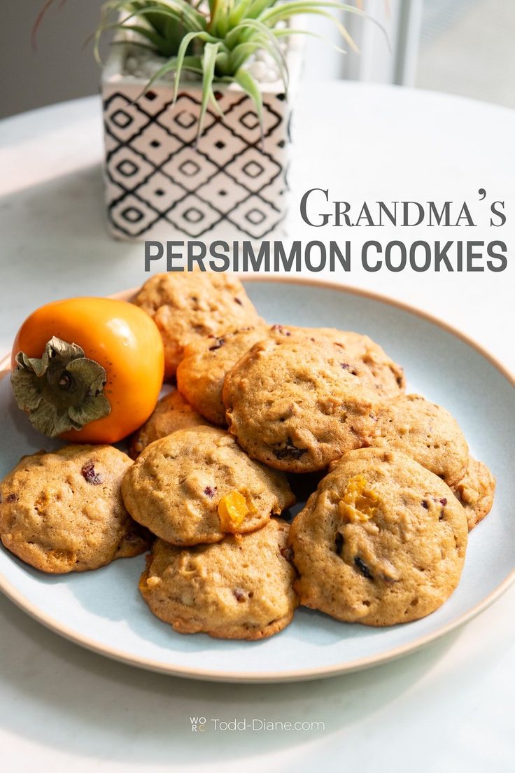 some cookies and an orange on a plate with the words grandma's persimmon cookies