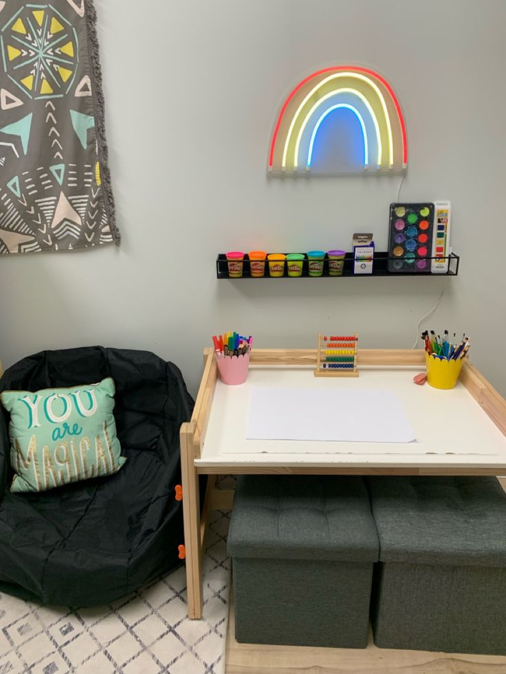 a child's playroom with toys and art supplies