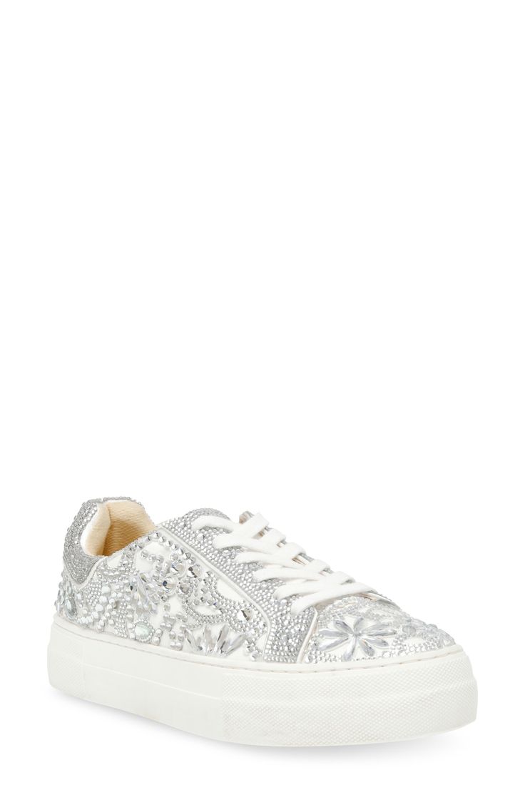 Luxe rhinestone embellishments and a hardy platform sole elevate this low-top sneaker to new heights. 1 1/4" platform Synthetic and textile upper/synthetic lining and sole Imported Bling Sneakers, Bridal Sneakers, Rhinestone Embellishments, White Bridal, Sneakers White, Betsey Johnson, Low Top, Top Sneakers, Womens Sneakers