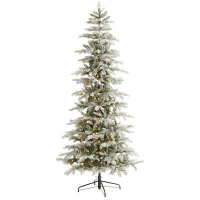 a white christmas tree with lights and snow on the branches, against a white background