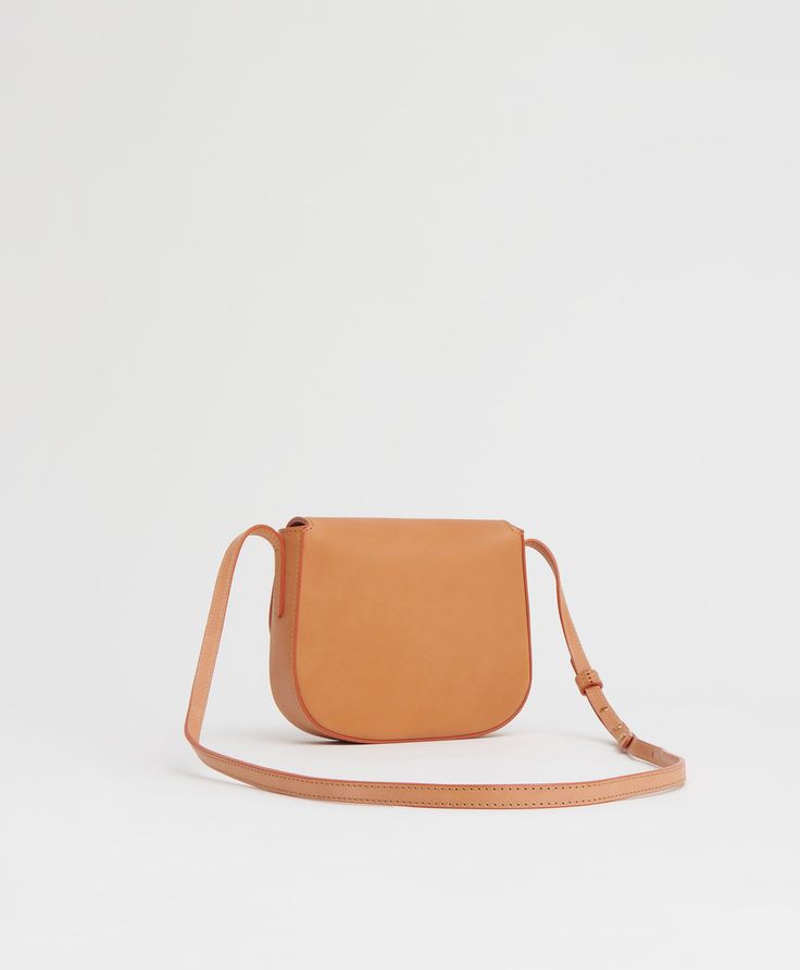 !!!Description---Our mini crossbody retains all the design details and function of the original hero. Made from our classic Vegetable Tanned leather, it features an adjustable strap and slim silhouette for comfortable carrying. !!!Fits---iPhone and smaller !!!Details--- Width: 6.3in / 16cmHeight: 5.9in / 15cmDepth: 1.6in / 4cmCrossbody Drop: Max 22.4 in / 57 cm, Min 17.3 in / 44 cm Composition: Self:100% Italian Vegetable Tanned LeatherLining: 100% Italian Canvas Made in Italy !!!Materials---Our Classic Leather Strap Crossbody Saddle Bag, Vegetable Tanned Leather Crossbody Saddle Bag, Sun Shadow, Lady M, Wallet Gifts, Black Sand, Monogrammed Items, Classic Mini, Mini Crossbody