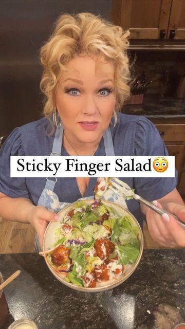 a woman holding a plate with food on it and the words sticky finger salad in front of her face