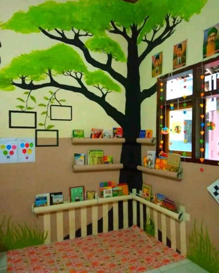 a child's room with a tree painted on the wall