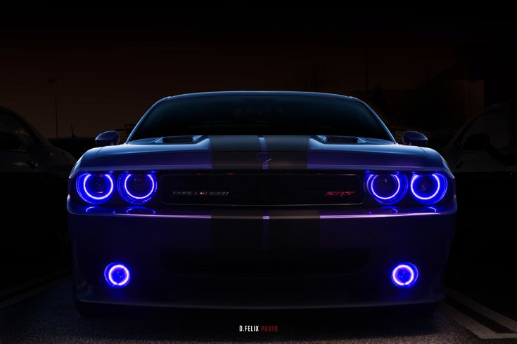 the front end of a car with blue lights