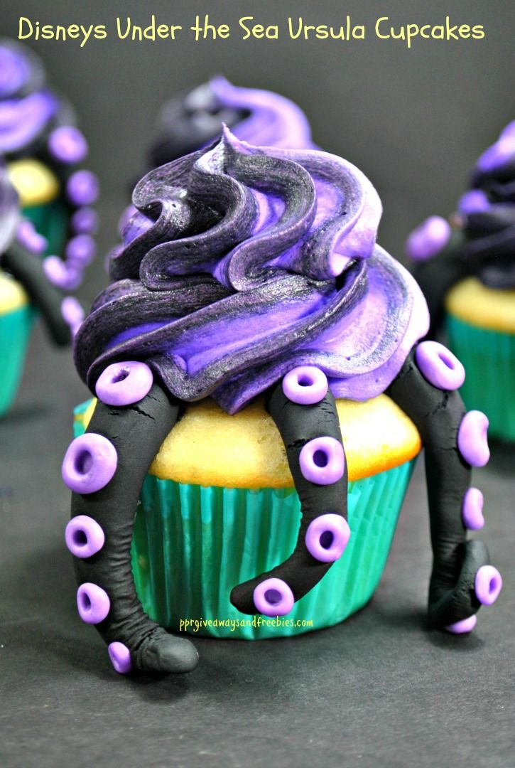 cupcakes decorated with purple and black icing