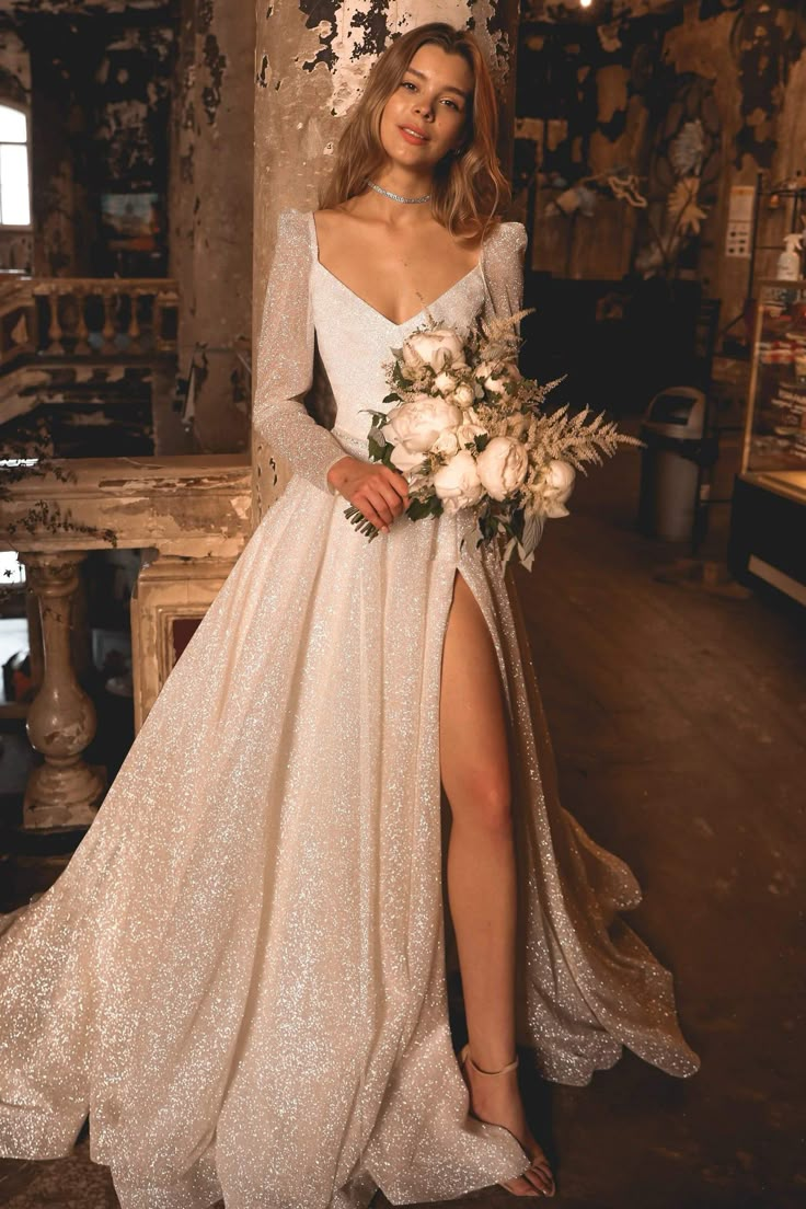 a woman in a white dress holding a bouquet