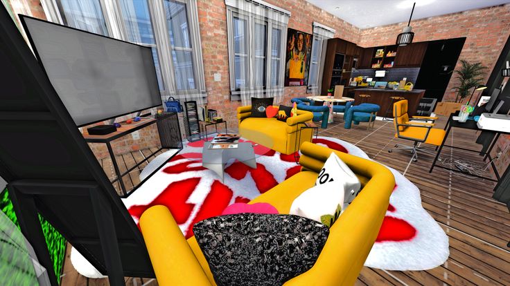 a living room filled with furniture and a flat screen tv sitting on top of a wooden floor