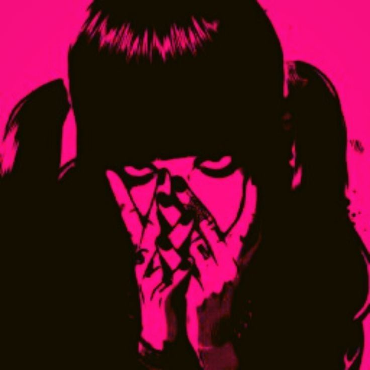 a woman covering her face with her hands in front of her face, against a pink background