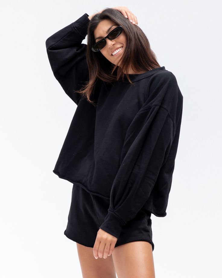 For sport, court and airport— naturally breathable, preshrunk, cozy. This full length sleeve and oversized crew neck makes you look put together but feel like you’re at home, you won’t know how you lived without it. Black Top For Lounging In Fall, Black Comfortable Sweats With Ribbed Cuffs, Comfortable Black Sweats With Ribbed Cuffs, Relaxed Fit Crew Neck Tops For Lounging, Comfy Oversized Black Sweatshirt, Comfy Black Sweatshirt For Loungewear, Oversized Comfortable Black Sweater, Oversized Sporty Tops For Lounging, Black Relaxed Fit Comfortable Sweater