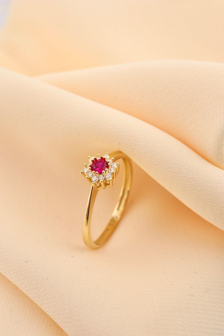 14k Solid Gold Daintly Flower Ring - Minimalist Wedding Ring - Anniversary Ring - Gold Floral Ring - Red Stone Flower Ring This solid gold dainty ring is made entirely from 14k solid gold. * Jewelry is packaged and shipped in a delicate jewelry gift box. * If you are purchasing it as a gift, please feel free to add a personal note. Anniversary, Gift For Wife, Christmas Gift Gold Kt: 14K solid gold * Available Gold Color:  * Guaranteed Authentic 14k Gold, Not Plated Or Filled * Stamp: 14K Gold Ring Designs Flower, Elegant Gold Flower Ring With Ruby, Wedding Stackable Ruby Rings In Gold, Dainty Red Diamond Promise Ring, Elegant Flower-shaped Birthstone Ring For Wedding, Red Flower-shaped Ring For Wedding, Red Flower Shaped Wedding Ring, Elegant Red Ruby Toe Ring, 14k Gold Flower Toe Ring For Wedding