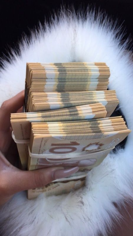 someone is holding stacks of money in their hand and it looks like they are counting them