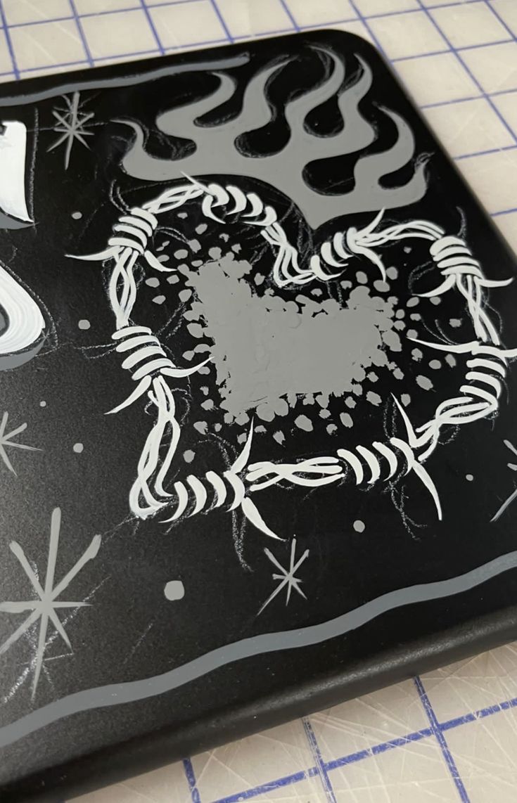 a black and white square with an octopus on it