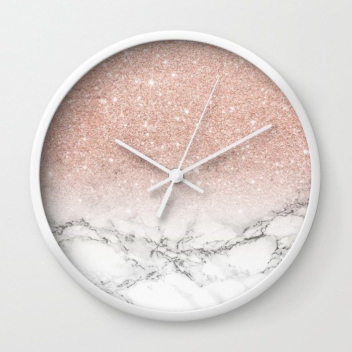 a clock with pink and white marble on it