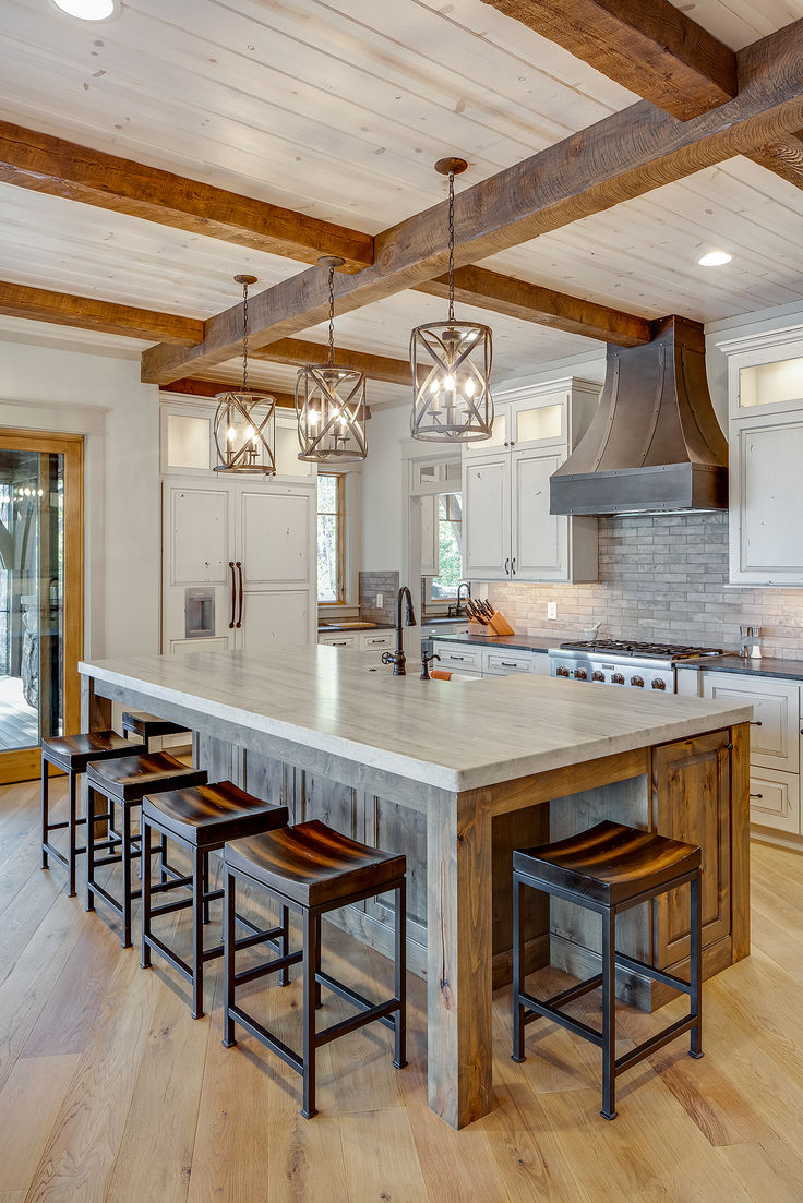 a large kitchen with an island in the middle