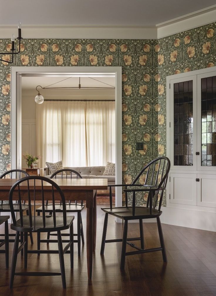 the dining room table is surrounded by chairs