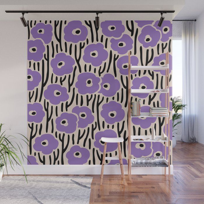 purple flowers on black and white wallpaper in a room with wooden flooring, planters and ladder