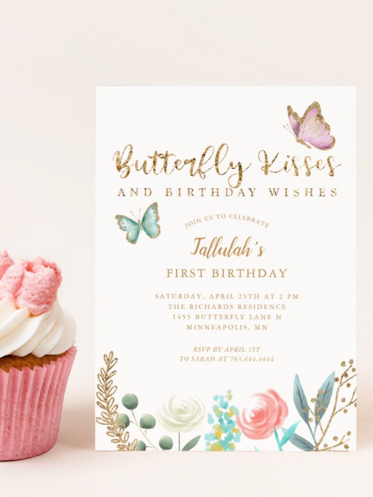 a cupcake with pink frosting on it next to a card that says butterfly kisses and birthday wishes