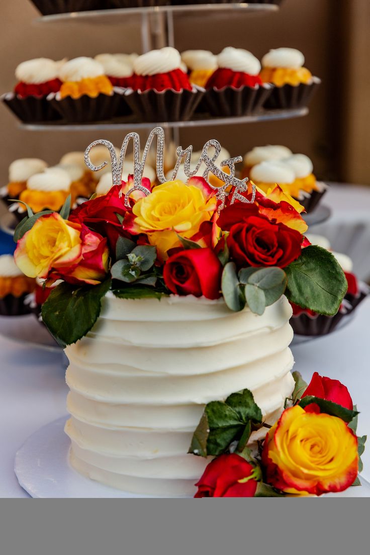 there is a cake with flowers on the table