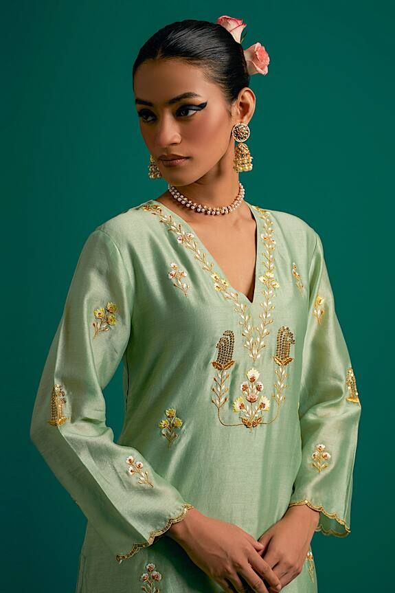 Green silk chanderi kurta with sequins, cutdana and resham hand embroidery. Comes with pant.
Components: 2
Pattern: Hand embroidered
Type Of Work: Sequins, Cutdana, Resham
Neckline: V Neck
Sleeve Type: Full
Fabric: Silk chanderi
Color: Green
Other Details: 
Model Height: 5ft 6inches, wearing size S
Occasion: Sangeet - Aza Fashions Chanderi Dupatta, Kurta Pant Set, Kurta With Pants, Fabric Silk, Green Silk, Pant Set, Set For Women, Aza Fashion, Model Height