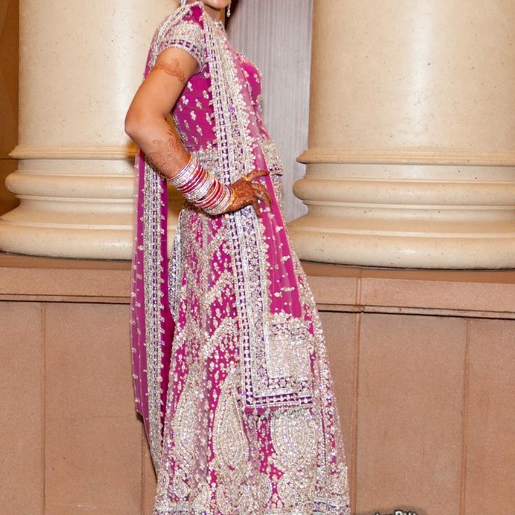 Light Pink Heavily Embellished Net Lehenga Choli With Detailed Silver Accent Hand Embroidery All Over The Blouse, Lehenga And The Chunni. The Lehenga Has Straps Attached To Hold The Weight Of It. Worn Once For Few Hours In Great Condition. Estimated Measurements ~ Top: Bust 37, Waist 34, Length 20 Lehenga Length: 47. Includes Zipper, Margins 2’ Each Side *Almost All Outfits And Jewelry Pieces Are Pre Worn. Worn Items Will Show Signs Of Wear, And Are In The Same Condition As Shown In The Pictures Silver Anarkali Set With Traditional Drape, Silver Lehenga With Traditional Drape, Silver Cutdana Lehenga, Silver Choli With Sheer Dupatta, Silver Zari Traditional Wear For Reception, Silver Traditional Wear With Zari Work For Reception, Silver Lehenga With Cutdana For Reception, Silver Traditional Wear With Dupatta For Navratri, Silver Traditional Wear With Cutdana For Reception