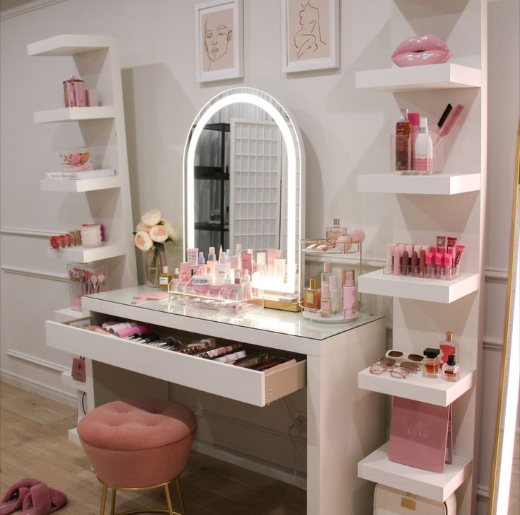 a vanity with lots of cosmetics on it in a room filled with shelves and mirrors