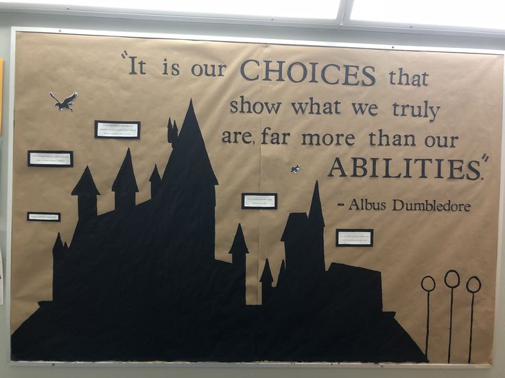 a bulletin board with an image of a castle and some words on the back wall