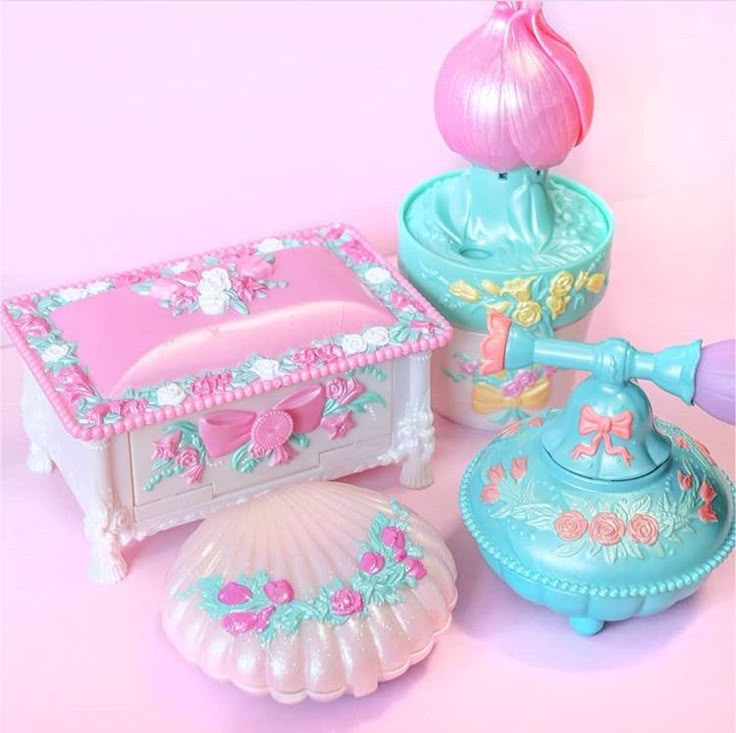 an assortment of toy items on a pink background