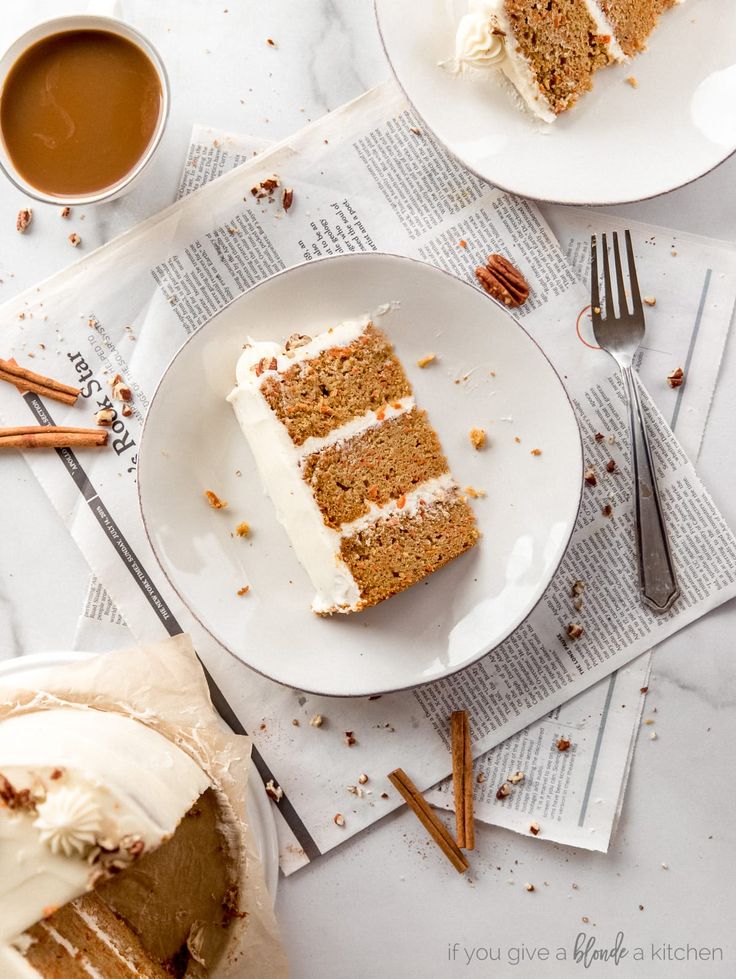 two slices of carrot cake on plates with coffee and cinnamon sticks next to the plate