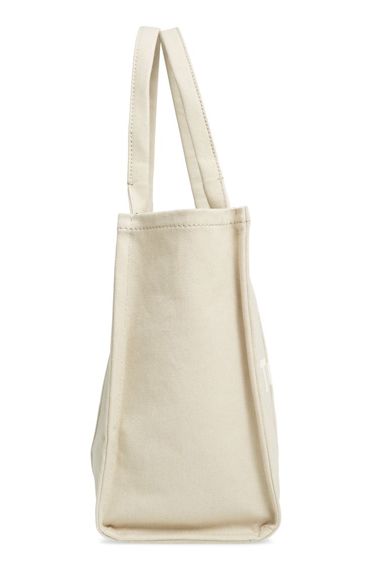 Easy top handles provide a convenient carrying option for this roomy canvas tote that folds flat for storage or travel. Style Name:Marc Jacobs Traveler Canvas Tote. Style Number: 5998359. Beige Bags With Reinforced Handles, Beige Everyday Bags With Reinforced Handles, Everyday Beige Bags With Reinforced Handles, Canvas Bag With Reinforced Double Handles, Canvas Bags With Reinforced Double Handles, Canvas Tote Shoulder Bag With Reinforced Handles, Beige Canvas Bag With Reinforced Handles For Travel, On-the-go Canvas Tote Bag With Reinforced Handles, Beige Shoulder Bag With Reinforced Handles