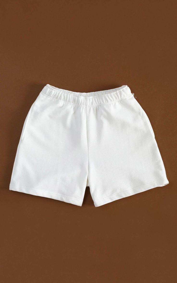 Cozy and consciously made, our 100% Organic Traceable Cotton Sweatshorts are the perfect intersection of sustainability and street style. LEARN MORE → certified organic fibre→ free from toxic substances like bleach & formaldehyde→ colored with nontoxic dyes→ water and energy are monitored→ manufactured in safe working conditions MeasurementsSizes: XS, S, M, L, XL, XXLColor: Off-white SIZE CHART Basic White Bottoms With Built-in Shorts, Basic Cotton Shorts For Summer, Relaxed Fit White Bottoms With Built-in Shorts, Basic Relaxed Fit Summer Shorts, Basic Relaxed Fit Shorts, Relaxed Fit Cotton Shorts In Solid Color, Basic Cotton Athletic Shorts For Summer, Solid Color Cotton Shorts, Basic White Cotton Shorts