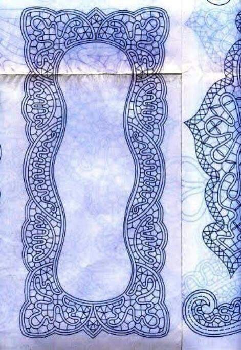 two blue papers with intricate designs on them