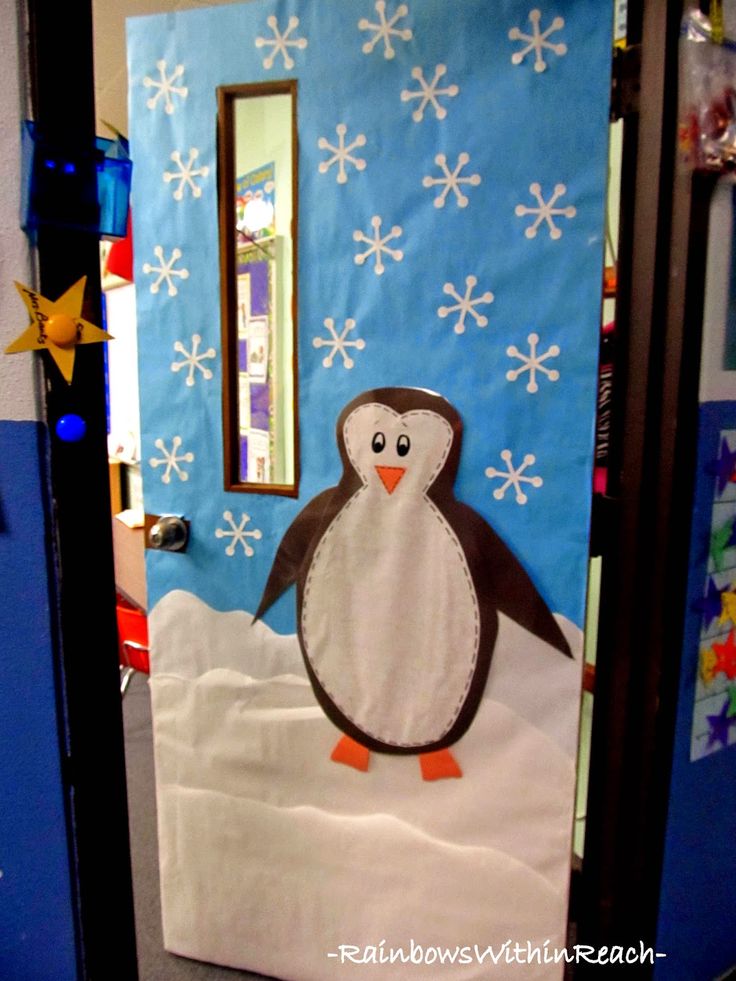 a door decorated with a penguin and snowflakes