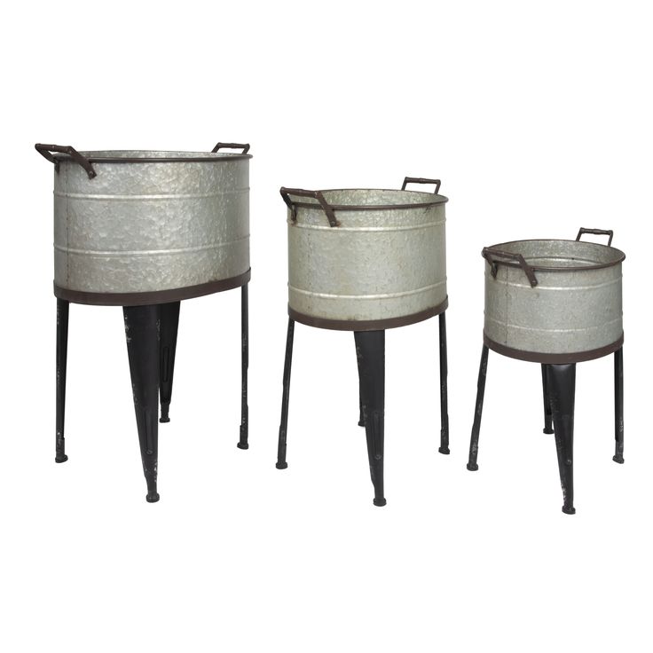 three metal buckets sitting next to each other