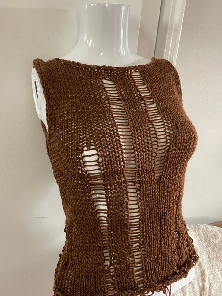 a brown knitted top on a mannequin