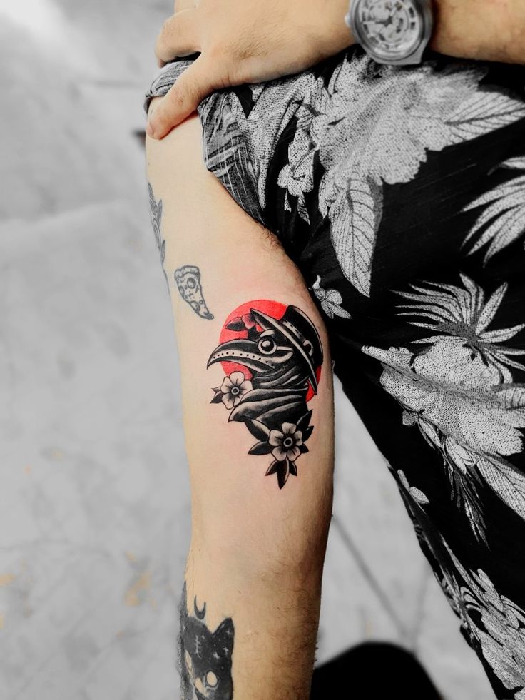 a person with a tattoo on their arm