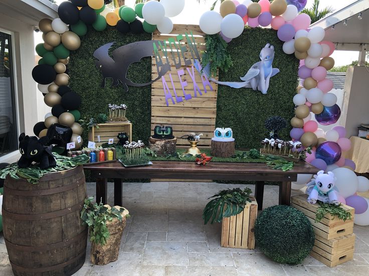 an outdoor party with balloons and decorations