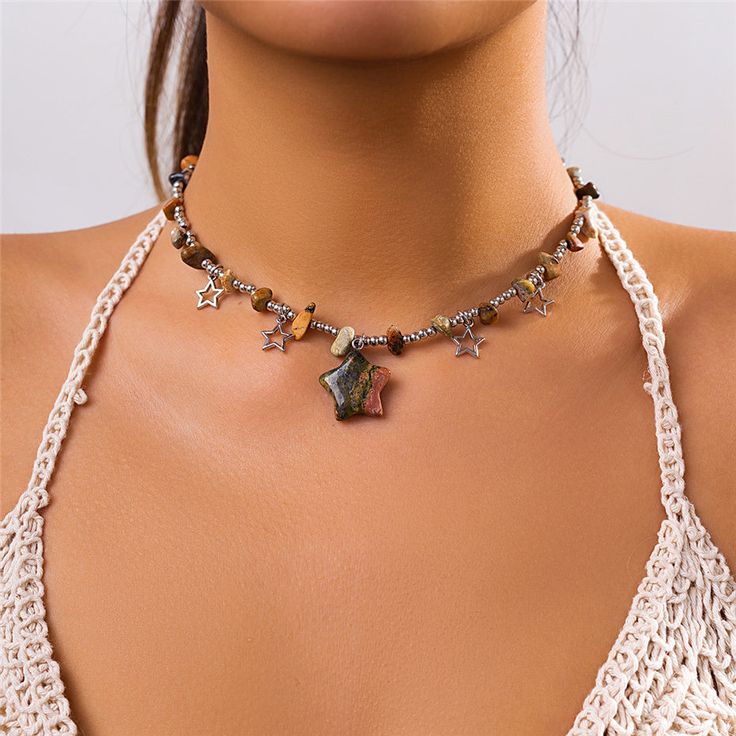 Features: Introducing the Boho Colorful Irregular Stone Choker Necklace. Made with eye-catching beads and featuring a unique hollow star pendant, this necklace is the perfect addition to any summer outfit. Elevate your style and embrace the Y2K trend with this statement jewelry piece.