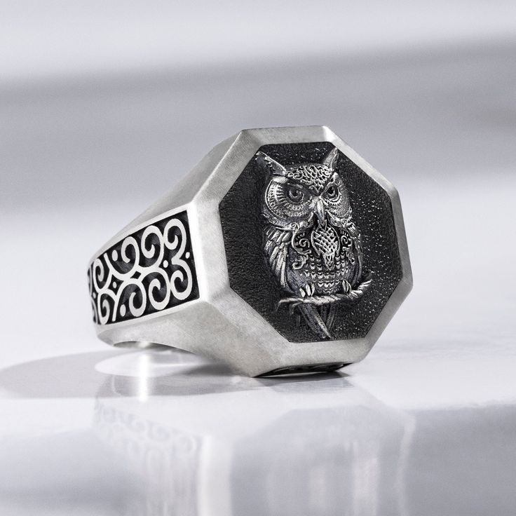 This Sterling Silver Engraved Celtic Owl Signet Ring is made of the highest quality, specially designed to stand out. This signet ring is perfect for individuals who enjoy wearing an animal jewelry or a subtle owl ring that matches their nature-themed style! This dainty ring is made from solid sterling silver, oxidized, polished, gold plated, rose plated and black rhodium with a  finish. It is great for people who love to wear a signet ring! The ring is delicately engraved with a geometric. This Engraved Metal Skull Ring As A Gift, Gift Engraved Stainless Steel Skull Ring, Symbolic Stainless Steel Skull Ring As Gift, Gift Skull Ring In Stainless Steel, Gift Stainless Steel Skull Ring, Round Steel Shank Rings As Gifts, Round Ring With Steel Shank For Gift, Symbolic Stainless Steel Signet Ring Gift, Celtic Owl